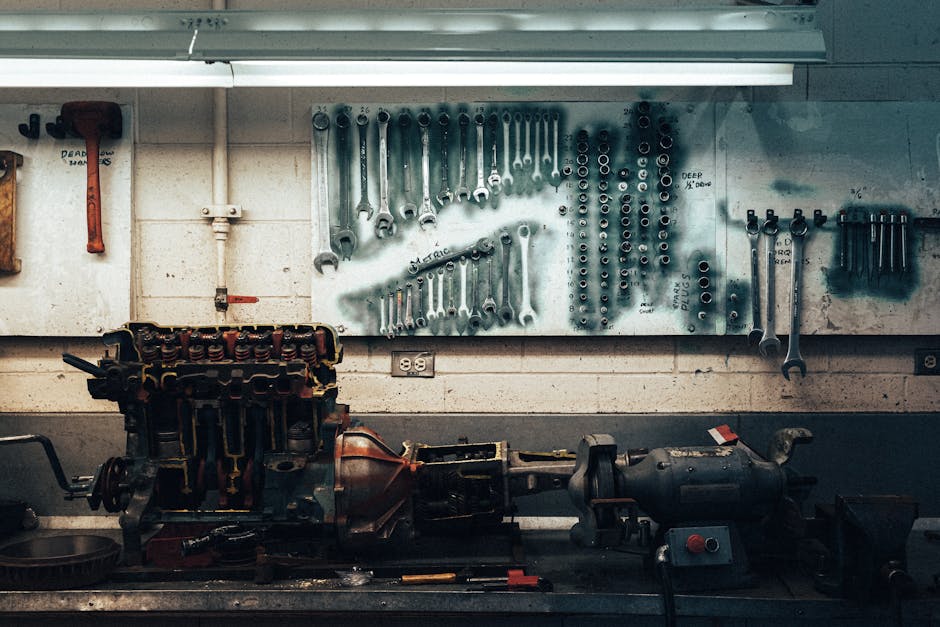 A well-organized workshop scene featuring tools and machinery on a workbench.